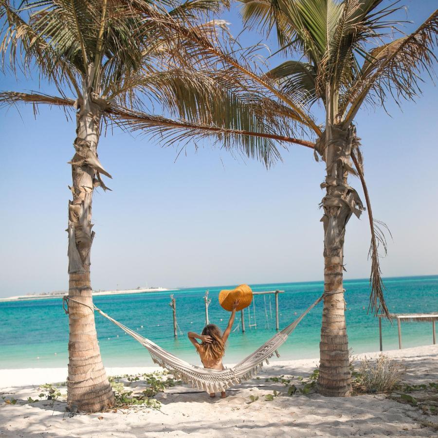 Nurai Island, Saadiyat Hotel Abu Dhabi Exterior photo Hammock on the beach